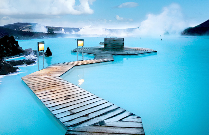Book yourself a trip with a long Icelandic layover and visit the extraordinary Blue Lagoon. 